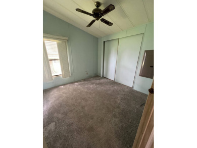 Welcome to this beautifully maintained 2/2 home where you will on Lake Henry Golf Club in Florida - for sale on GolfHomes.com, golf home, golf lot
