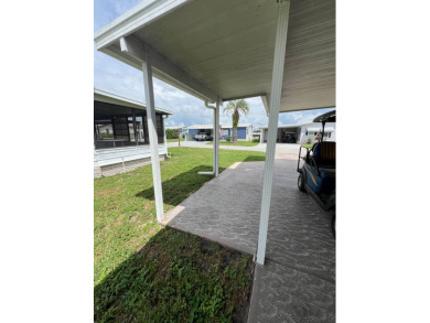 Welcome to this beautifully maintained 2/2 home where you will on Lake Henry Golf Club in Florida - for sale on GolfHomes.com, golf home, golf lot