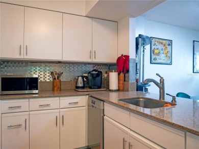 Welcome to Crystal Bay, where a bright and updated condo waits on Feather Sound Country Club in Florida - for sale on GolfHomes.com, golf home, golf lot