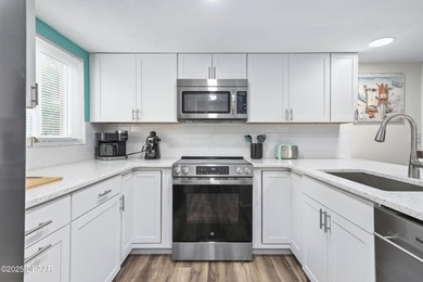 Listed below appraised value, this beautifully updated 3-bedroom on The Club At Pelican Bay - South Course in Florida - for sale on GolfHomes.com, golf home, golf lot