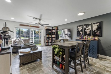 Affordable and stylishly renovated waterfront townhouse in the on Woodmont Country Club in Florida - for sale on GolfHomes.com, golf home, golf lot