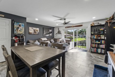 Affordable and stylishly renovated waterfront townhouse in the on Woodmont Country Club in Florida - for sale on GolfHomes.com, golf home, golf lot