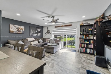 Affordable and stylishly renovated waterfront townhouse in the on Woodmont Country Club in Florida - for sale on GolfHomes.com, golf home, golf lot
