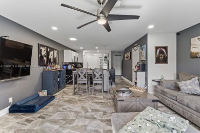 Affordable and stylishly renovated waterfront townhouse in the on Woodmont Country Club in Florida - for sale on GolfHomes.com, golf home, golf lot