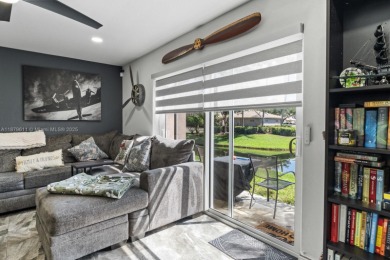Affordable and stylishly renovated waterfront townhouse in the on Woodmont Country Club in Florida - for sale on GolfHomes.com, golf home, golf lot