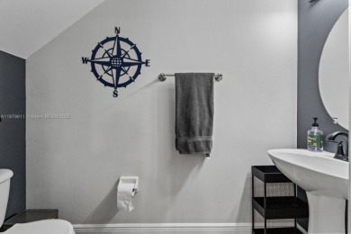Affordable and stylishly renovated waterfront townhouse in the on Woodmont Country Club in Florida - for sale on GolfHomes.com, golf home, golf lot