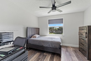 Affordable and stylishly renovated waterfront townhouse in the on Woodmont Country Club in Florida - for sale on GolfHomes.com, golf home, golf lot