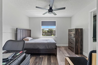 Affordable and stylishly renovated waterfront townhouse in the on Woodmont Country Club in Florida - for sale on GolfHomes.com, golf home, golf lot