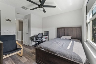 Affordable and stylishly renovated waterfront townhouse in the on Woodmont Country Club in Florida - for sale on GolfHomes.com, golf home, golf lot