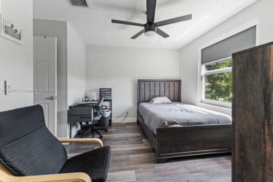 Affordable and stylishly renovated waterfront townhouse in the on Woodmont Country Club in Florida - for sale on GolfHomes.com, golf home, golf lot