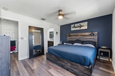Affordable and stylishly renovated waterfront townhouse in the on Woodmont Country Club in Florida - for sale on GolfHomes.com, golf home, golf lot