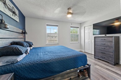 Affordable and stylishly renovated waterfront townhouse in the on Woodmont Country Club in Florida - for sale on GolfHomes.com, golf home, golf lot