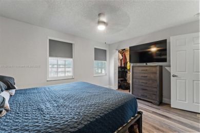 Affordable and stylishly renovated waterfront townhouse in the on Woodmont Country Club in Florida - for sale on GolfHomes.com, golf home, golf lot