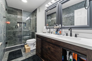 Affordable and stylishly renovated waterfront townhouse in the on Woodmont Country Club in Florida - for sale on GolfHomes.com, golf home, golf lot