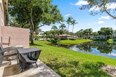 Affordable and stylishly renovated waterfront townhouse in the on Woodmont Country Club in Florida - for sale on GolfHomes.com, golf home, golf lot