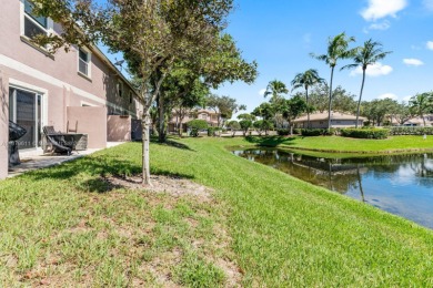Affordable and stylishly renovated waterfront townhouse in the on Woodmont Country Club in Florida - for sale on GolfHomes.com, golf home, golf lot