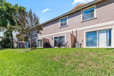 Affordable and stylishly renovated waterfront townhouse in the on Woodmont Country Club in Florida - for sale on GolfHomes.com, golf home, golf lot