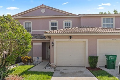 Affordable and stylishly renovated waterfront townhouse in the on Woodmont Country Club in Florida - for sale on GolfHomes.com, golf home, golf lot