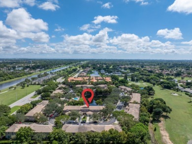 Affordable and stylishly renovated waterfront townhouse in the on Woodmont Country Club in Florida - for sale on GolfHomes.com, golf home, golf lot