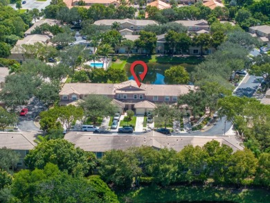 Affordable and stylishly renovated waterfront townhouse in the on Woodmont Country Club in Florida - for sale on GolfHomes.com, golf home, golf lot