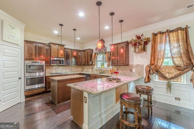 Discover this beautifully designed 4-sided brick home tucked on Crystal Lake Golf and Country Club in Georgia - for sale on GolfHomes.com, golf home, golf lot