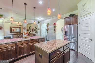 Discover this beautifully designed 4-sided brick home tucked on Crystal Lake Golf and Country Club in Georgia - for sale on GolfHomes.com, golf home, golf lot