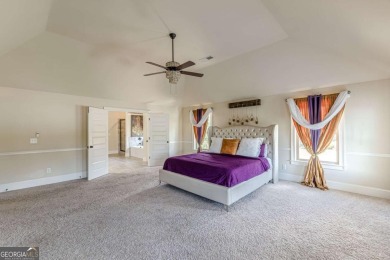 Discover this beautifully designed 4-sided brick home tucked on Crystal Lake Golf and Country Club in Georgia - for sale on GolfHomes.com, golf home, golf lot