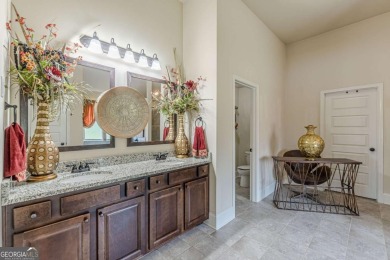 Discover this beautifully designed 4-sided brick home tucked on Crystal Lake Golf and Country Club in Georgia - for sale on GolfHomes.com, golf home, golf lot
