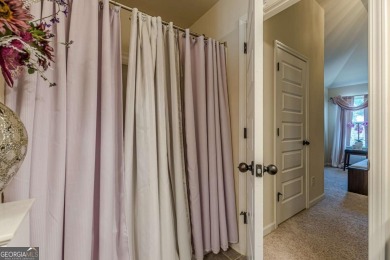 Discover this beautifully designed 4-sided brick home tucked on Crystal Lake Golf and Country Club in Georgia - for sale on GolfHomes.com, golf home, golf lot
