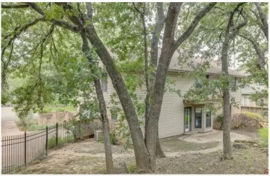 New flooring in living room, kitchen 2 bedrooms and 2 bathrooms on Chester W. Ditto Golf Course in Texas - for sale on GolfHomes.com, golf home, golf lot