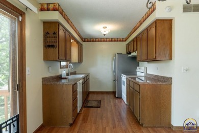 Don't miss this well-maintained and move-in-ready half-duplex on Lake Shawnee Golf Course in Kansas - for sale on GolfHomes.com, golf home, golf lot