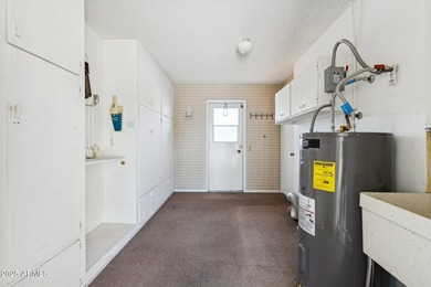 This Sun City home has 3 bedrooms and 2 updated bathrooms on Sun City Lakes West and East in Arizona - for sale on GolfHomes.com, golf home, golf lot