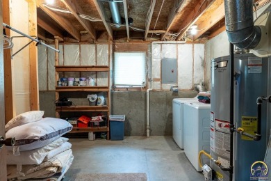 Don't miss this well-maintained and move-in-ready half-duplex on Lake Shawnee Golf Course in Kansas - for sale on GolfHomes.com, golf home, golf lot