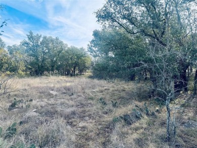 This 0.56-acre lot, located just outside the Hideout Golf Course on Hideout Golf Club and Resort  in Texas - for sale on GolfHomes.com, golf home, golf lot