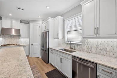 Experience luxury living in this rare 4-bedroom, 3-bath + den on Esplanade Golf and  Country Club in Florida - for sale on GolfHomes.com, golf home, golf lot