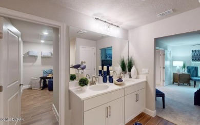 BRAND NEW PHASE! The Blossom II is a two-story townhome with 3 on Plantation Bay Golf and Country Club in Florida - for sale on GolfHomes.com, golf home, golf lot