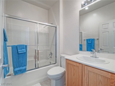 From the moment you enter the gated courtyard, you're greeted on Aliante Golf Club in Nevada - for sale on GolfHomes.com, golf home, golf lot