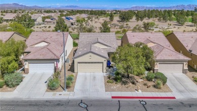 From the moment you enter the gated courtyard, you're greeted on Aliante Golf Club in Nevada - for sale on GolfHomes.com, golf home, golf lot