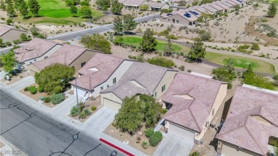From the moment you enter the gated courtyard, you're greeted on Aliante Golf Club in Nevada - for sale on GolfHomes.com, golf home, golf lot
