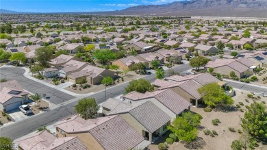 From the moment you enter the gated courtyard, you're greeted on Aliante Golf Club in Nevada - for sale on GolfHomes.com, golf home, golf lot