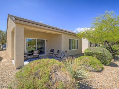 From the moment you enter the gated courtyard, you're greeted on Aliante Golf Club in Nevada - for sale on GolfHomes.com, golf home, golf lot