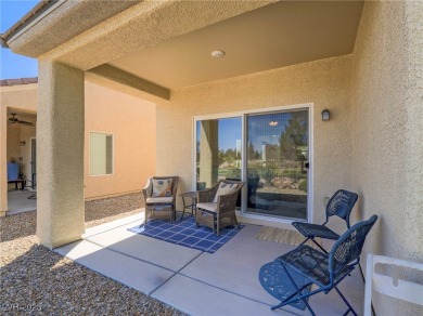 From the moment you enter the gated courtyard, you're greeted on Aliante Golf Club in Nevada - for sale on GolfHomes.com, golf home, golf lot