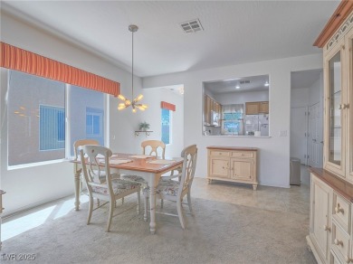 From the moment you enter the gated courtyard, you're greeted on Aliante Golf Club in Nevada - for sale on GolfHomes.com, golf home, golf lot