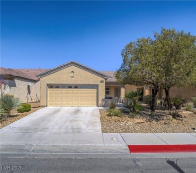 From the moment you enter the gated courtyard, you're greeted on Aliante Golf Club in Nevada - for sale on GolfHomes.com, golf home, golf lot
