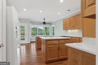 Experience refined lakefront living at its finest at 1390 Winged on Harbor Club Golf and Country Club in Georgia - for sale on GolfHomes.com, golf home, golf lot