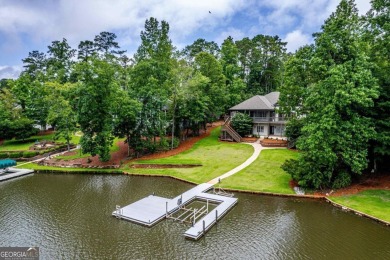Experience refined lakefront living at its finest at 1390 Winged on Harbor Club Golf and Country Club in Georgia - for sale on GolfHomes.com, golf home, golf lot