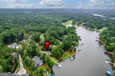 Experience refined lakefront living at its finest at 1390 Winged on Harbor Club Golf and Country Club in Georgia - for sale on GolfHomes.com, golf home, golf lot