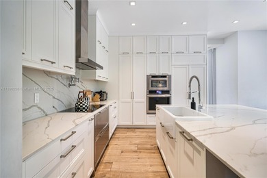 Rarely available two-story pool home with garage in gated on Turnberry Isle Resort and Club in Florida - for sale on GolfHomes.com, golf home, golf lot