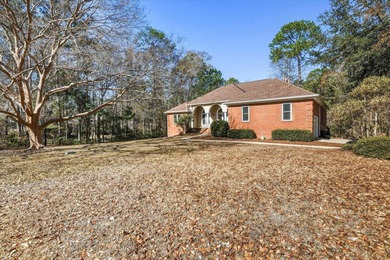 FRESH NEW LOOK on this Lovely Lakefront Home! Custom Brick on Golden Eagle Country Club in Florida - for sale on GolfHomes.com, golf home, golf lot