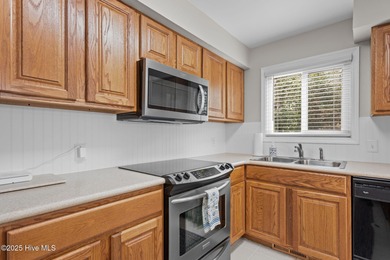 Discover this beautifully renovated, fully furnished end unit on Oak Island Golf Club in North Carolina - for sale on GolfHomes.com, golf home, golf lot